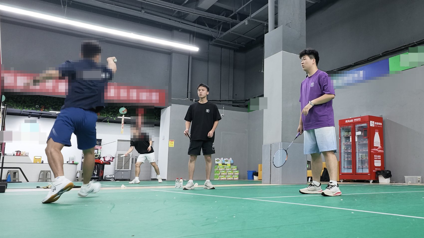 Evening of August 17: the coach correcting a player's demonstration from the sideline