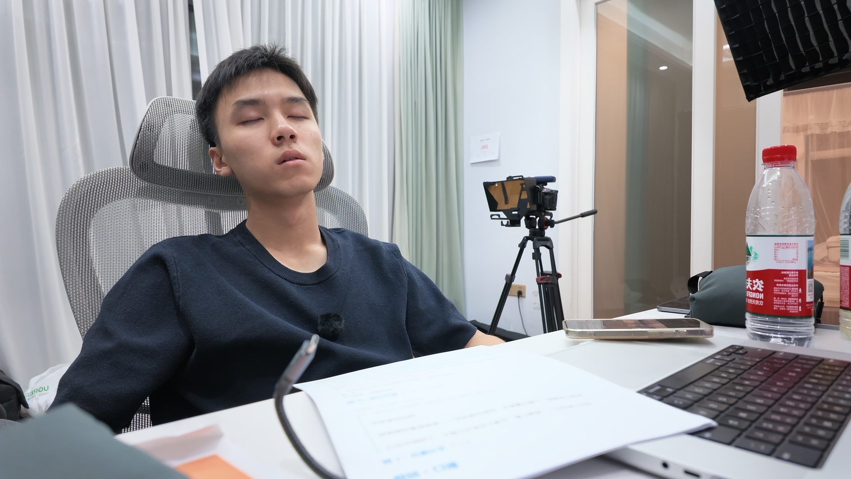 Slumped in a chair after a late night of development